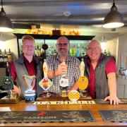 The Royal Oak Pub and Kitchen, in Old Malton, was featured in CAMRA's guide for the first time. Pictured: Landlord Steven Purcell (centre) with Ben (left) and Elliot (right) from the pub