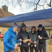 Pickering Running Club's men pose with their prize for second place in the Cod Beck Canter.