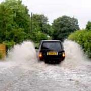 A vehicle tackles the floods at Marton