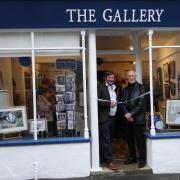 Angus Ashworth with Derek Thrippleton cutting the ribbon to declare the Gallery officially open