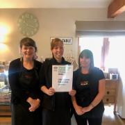 L-to-R Charlotte Corney, Louise Coverdale, and Kerrie Smith with the Travellers Choice certificate