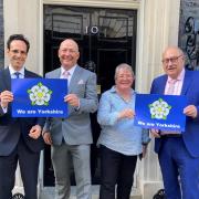 [L-R] Councillors George Jabbour, Phil Trumper, Heather Phillips and Andy Paraskos holding ‘We are Yorkshire’ posters outside 10 Downing Street.