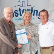 Foster carers John and Karen Pownall with North Yorkshire Council’s placement and fostering manager, Alan Tucker, after receiving an award for their fostering services