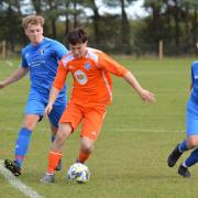 Heslerton’s Morgan Kendrew (orange) opened his account for the season against newcomers Lealholm.