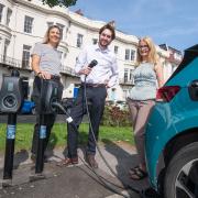 Kellie Lane, account manager at Connected Kerb, Harry Baross, climate change manager at North Yorkshire Council, and Jane Wilson, deputy parking manager at North Yorkshire Council. They are stood in Albion Road car park in Scarborough, where electric