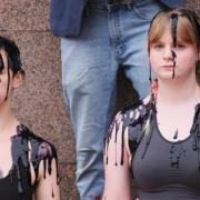 Activists from XR York covered in artificial oil during the demonstration outside Barclays bank in Parliament Street, York