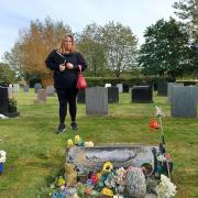 Tracey Smith at the gravestone of her brother