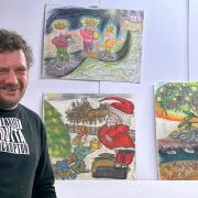 Rob Temple with his Christmas card designs