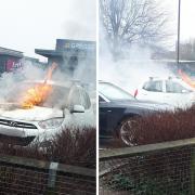 The car on fire in the car park of Foss Island Retail Park, York