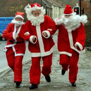 Rob Davies, centre, of Ryedale Special Families, is joined by Julie Rhodes, left, of Yorkshire Building Society, and Laura Rafferty-Trow, of Spectrum Solicitors, at the launch of Malton’s first-ever Santa Fun Run
