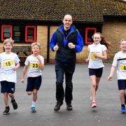 Dave Pearson, Kirkbymoorside 10k race secretary and director, helps pupils at Kirkbymoorside Primary School prepare for annual event in May     Picture: Nigel Holland