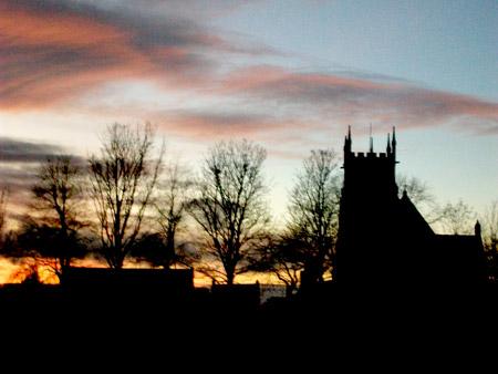Sunset on Christmas Day at St Peter's Church by Angela Gray of Norton.