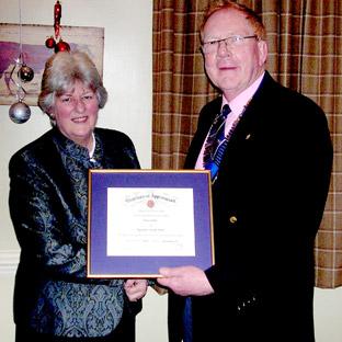 June Cook, from Kirkbymoorside, receives an award for her Volunteer community work from Dr David Jolliffe, president of Ryedale Lions Club.