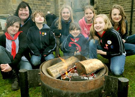 LOCAL groups got together to exchange ideas and information during a Community Showcase Day in Norton. Picture shows Members 
of 1st Norton Guides 
with their campfire outside St Peter’s Church.