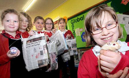 Pupils at West Heslerton Primary School who are making eco bedding for pets, pictured with Flash the gerbil.

