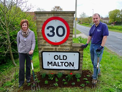 Two of the volunteers who smartened up the welcome signs at Norton, Malton and Old Malton.