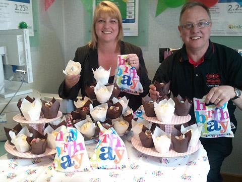 Justine Street, manager of Yorkshire Building Society’s Pickering
branch, and David Hebden, Yorkshire Air Ambulance community fundraiser, with
some of the birthday cupcakes sold to customers as part of a charity fundraiser.