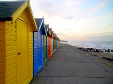 Whitby beachhuts at sunset by Gary Hornby