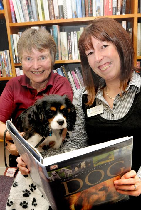 June Scatchard, left, puppy socialising volunteer for Hearing Dogs For Deaf People, with Sonny, at Malton library with Julie Atkinson, service development officer at the library.