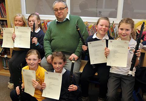 Clarinet teacher Robert Coates with some of his pupils at
Gillamoor Primary School who have passed exams with the
Associated Board of the Royal Schools of Music.