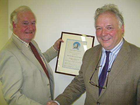 Ken Claridge, left, becomes Helmsley's first Freeman of the Town. He was presented with his certificate by Coun Martin Vander Weyer.