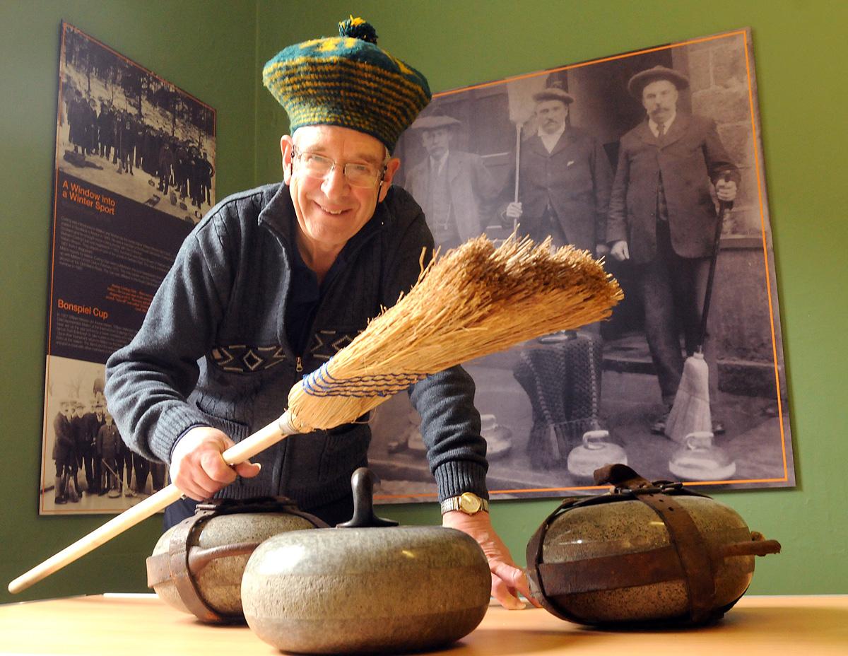 Derek Searle with the curling stones and Tam O'Shanter of his great-grandfather William Wilkinson at Malton Museum where the exhibition, Windows To The Past, is being held.