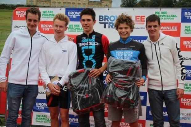 SUCCESS: Ryedale triathlete Tyler Hutchinson (second from right) pictured with Great Britain's Olympic heroes Alistair Brownlee (far left) and Jonny Brownlee (far right) after winning the Brownlee Triathlon junior event.