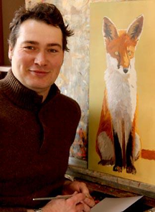 Artist Robert Fuller works on his painting of a fox